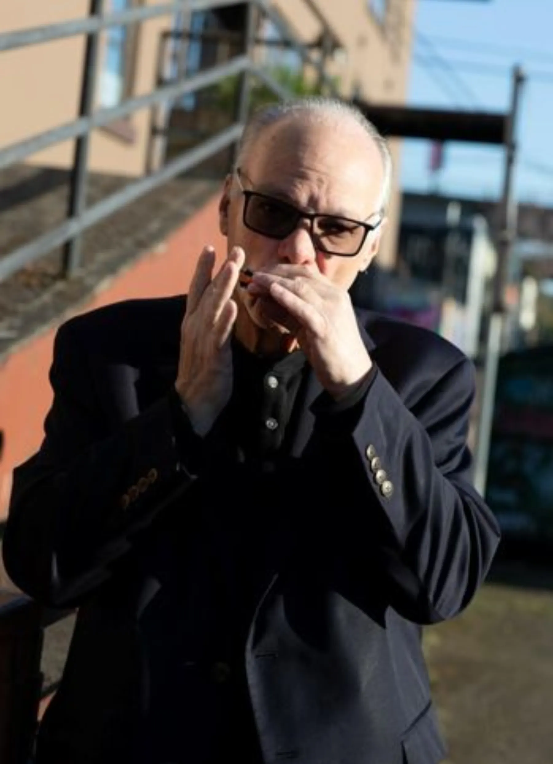 Curtis Salgado on harmonica outdoors